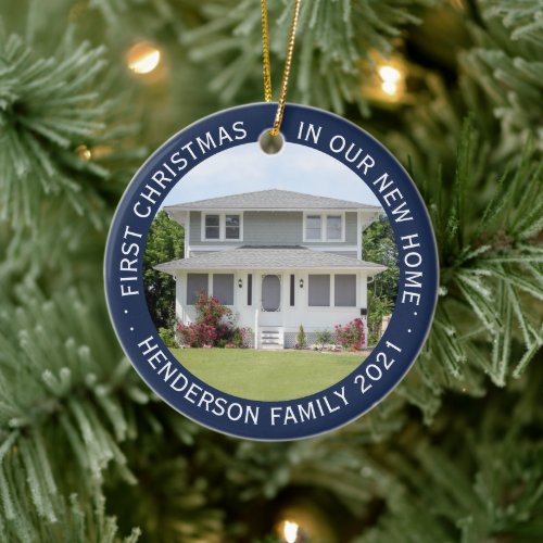 House Photos First Xmas New Home Name & Year Blue Ceramic Ornament - Celebrate the joy of your new place with a custom 2 photo "First Christmas in our New Home" navy blue and white round ceramic ornament. Wording and pictures on this template are simple to personalize. (IMAGE & TEXT DESIGN TIPS: 1) To adjust position of wording, add spaces at beginning or end. 2) To center the photo exactly how you want, crop it into a square shape before uploading to the Zazzle website.) Design features an elegant dark blue border, modern minimalist typography family name & year, and 2 images of your choice. This unique family keepsake adds a stylish touch to Xmas home decorations or makes a thoughtful housewarming realtor gift idea. There's no place like a new home for the holidays!