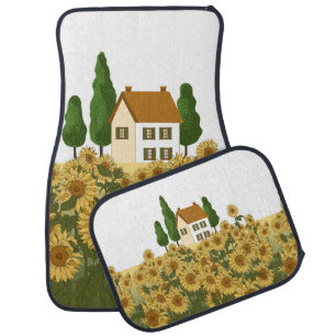 House, tall trees and a field of sunflowers in the car floor mat