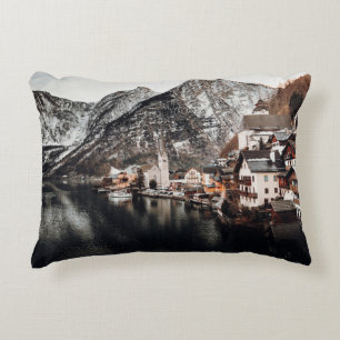 HOUSES NEAR BODY OF WATER AND MOUNTAIN ACCENT PILLOW