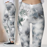 Howling Timber Wolves | Frozen Wilderness Magic Leggings<br><div class="desc">Embrace the wild call of the north with our "Midnight Pack" leggings. This ethereal design transports you to a frozen wilderness, where majestic timber wolves roam through a landscape of misty snow peaks and jagged mountain ridges. Featuring a breathtaking "double exposure" effect, the artwork centers on a soulful wolf guardian...</div>