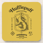 HUFFLEPUFF™ Dedication Patience Loyalty Crest Beverage Coaster<br><div class="desc">Celebrate loyalty, patience, and unwavering dedication with this bold Hufflepuff™ crest design. Featuring the proud badger set within a classic shield, this striking artwork highlights the house’s defining traits — Dedication, Patience, and Loyalty — in a timeless, vintage-inspired layout. Rendered in signature house colors with detailed linework and subtle magical...</div>