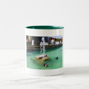 Humboldt penguins and fountains Two-Tone coffee mug
