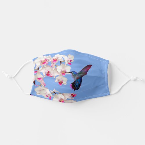 Hummingbird and orchids on sky blue adult cloth face mask