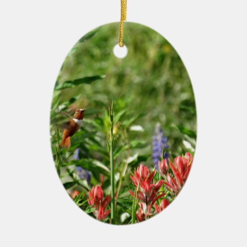 Hummingbird in wild flowers ceramic ornament
