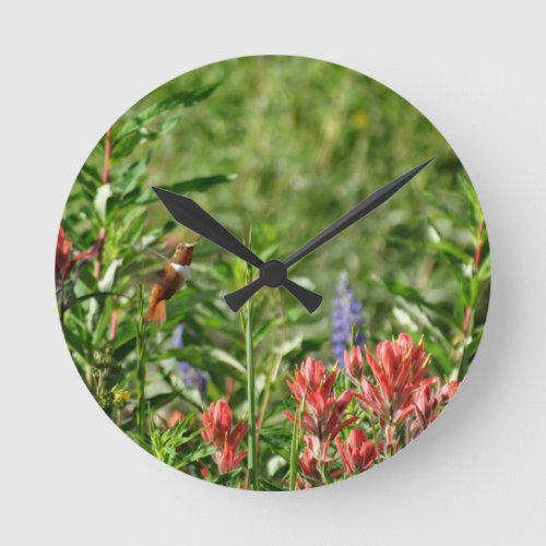 Hummingbird in wild flowers round clock
