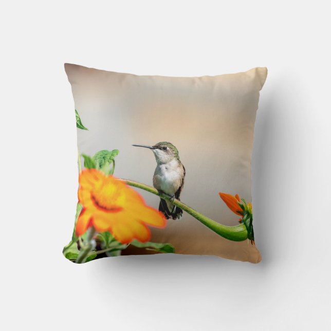 Hummingbird on a flowering plant throw pillow (Front)
