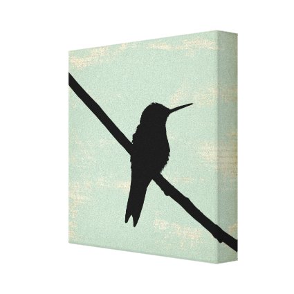 Hummingbird Silhouette on Blue Grunge Background Canvas Print
