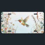 Hummingbird Wildflowers Blue License Plate<br><div class="desc">This whimsical license plate features a ruby-throated hummingbird surrounded by colorful wildflowers on a gradient sky blue and white background.</div>