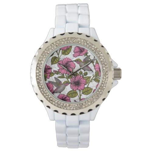 Hummingbirds and pink hibiscus flowers watch