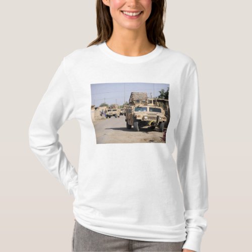 Humvees conduct security during a patrol T_Shirt