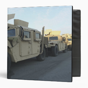 Humvees sit on the pier at Morehead City Binder