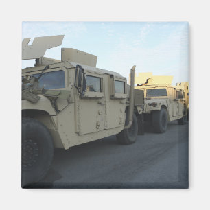 Humvees sit on the pier at Morehead City Magnet