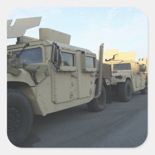 Humvees sit on the pier at Morehead City Square Sticker