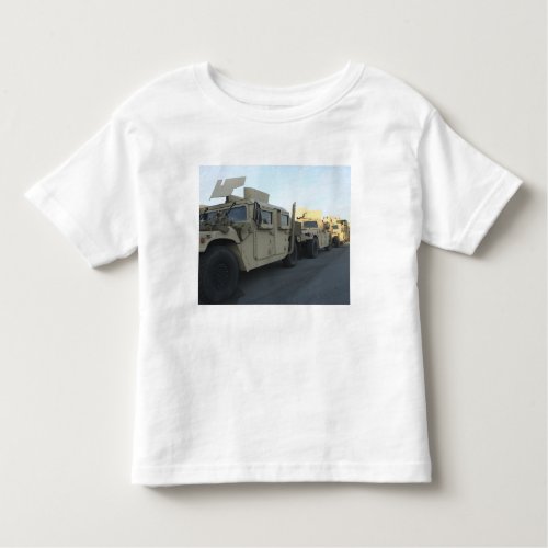 Humvees sit on the pier at Morehead City Toddler T_shirt