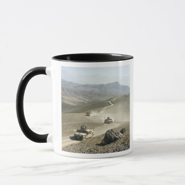 Humvees traverse rugged mountain roads mug (Left)