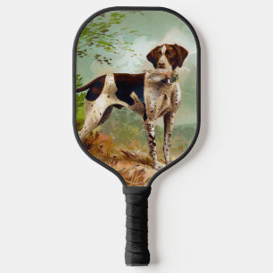 Hunter dog with bird in mouth pickleball paddle