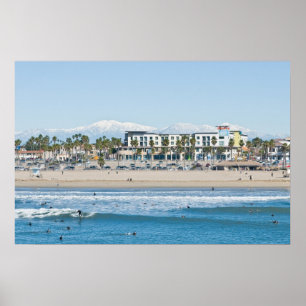 Huntington Beach and Snow Capped Mountains Poster