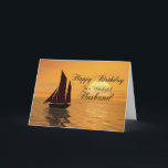 Husband, a sunset yacht birthday card<br><div class="desc">Send birthday greetings with this beautiful card. A yacht sails into a golden sunset over a tranquil ocean. A great card for a yachtsman or sailor.</div>