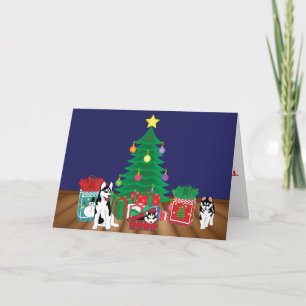 Huskies Playing Under the Christmas Tree Card