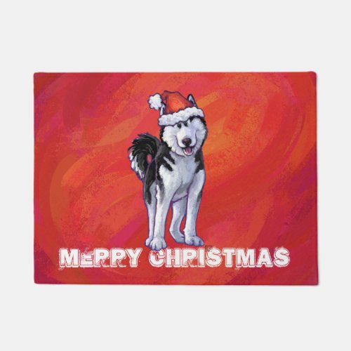 Husky in Santa Hat On Red Doormat