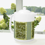 Hydrangea Celadon Green Floral Teapot<br><div class="desc">This garden fresh green teapot features 3 panels of tiny delicate blossoms of a pale celadon green hydrangea flower. It is a unique color that is fresh and light with the feel of a charming country cottage garden. It is a summery floral in subtle soft tonal shades and details. It...</div>