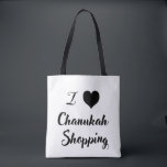 I 🖤 Chanukah. Shopping Tote Bag<br><div class="desc">Bring some fun and whimsy to your holiday errands with our festive I 🖤 Chanukah shopping tote! Featuring a bold typography design with contrasting black and white coloring. this eco-friendly tote is perfect for carrying gifts, groceries, and more while spreading Chanukah joy” Durable, spacious, and stylish, it’s the ultimate holiday...</div>