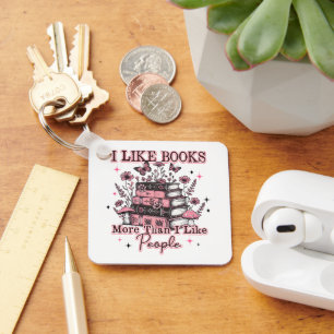 I Like Books More Than.... Keychain