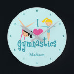 I Love Gymnastics Cute Personalized Teal Gymnast Round Clock<br><div class="desc">I Love Gymnastics. A pretty gymnastics girls room clocks with adorable teal text in between two tumbling girls and a beautiful pink heart. Cute gymnast decor for a kids gym or women's gymnastic coach.</div>