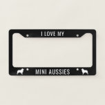 I Love My Mini Aussies (Mini Australian Shepherds) License Plate Frame<br><div class="desc">A fun auto accessory for the vehicle shared by you and your Miniature Australian Shepherds! This cute Mini Aussie lover's license plate cover can be personalized with your own message. Black with white dog silhouettes. Visit Jenn's Doodle World for more cool custom license plate covers for lovers of all dog...</div>
