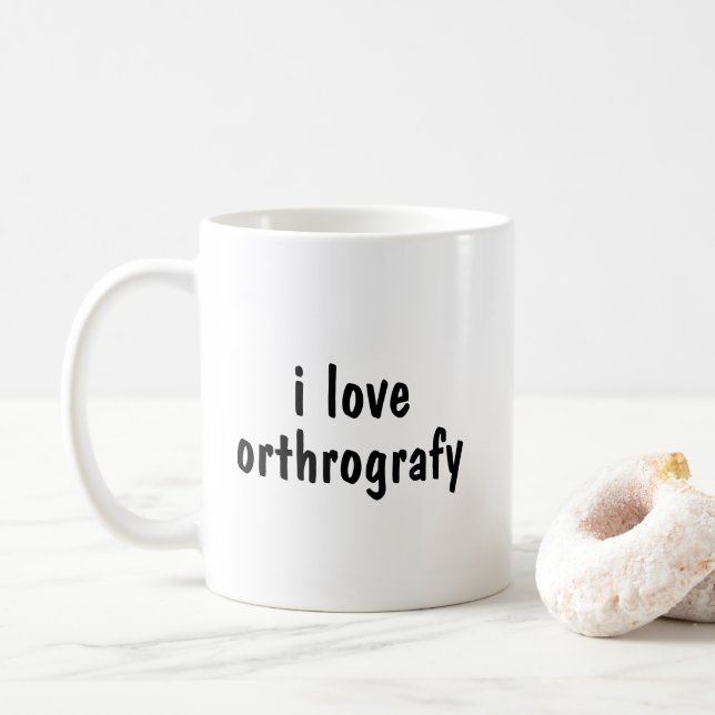 I Love Orthography Funny Spelling Joke Mug (With Donut)