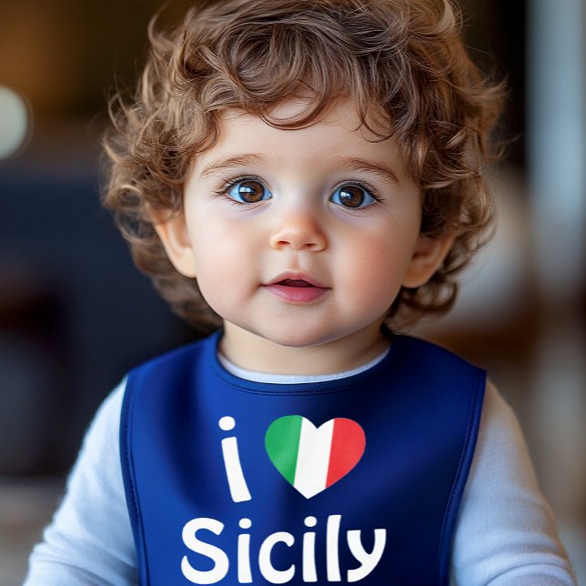 I Love Sicily Baby Bib (Royal blue baby bib featuring the word “Sicily” in a rounded, bouncy font with an Italian flag heart)