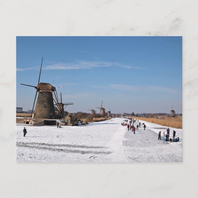 Ice skating along the windmills in winter postcard (Front)