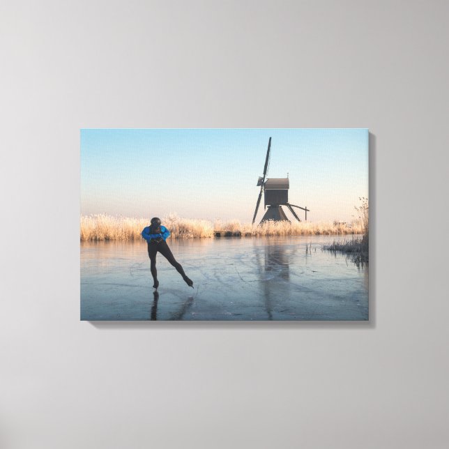 Ice skating past windmill and reeds canvas print (Front)