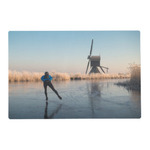 Ice skating past windmill and reeds placemat