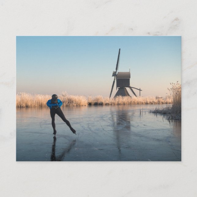 Ice skating past windmill and reeds postcard (Front)