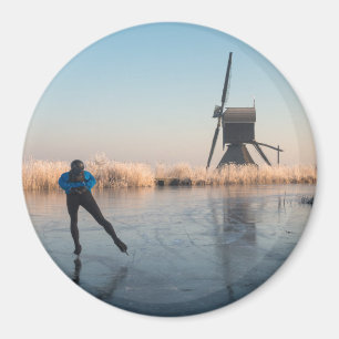 Ice skating past windmill & reeds round magnet