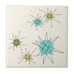 Iconic Atomic Starbursts Small Ceramic Tile<br><div class="desc">This Iconic Atomic Starbursts Small Ceramic Tile pattern features iconic atomic starbursts. That’s right! The old school, cream colored background with gold speckles is the perfect backdrop for the vibrant turquoise, soothing celery, and kitschy pear green colored circles. The spots of color are sporadically placed in various sizes with overlaying...</div>