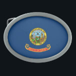 Idaho Flag: the Gem State, America Mountain West Belt Buckle<br><div class="desc">The Idaho state flag, a simple yet powerful emblem, was officially adopted in 1907. Its design, a field of blue emblazoned with the state seal, reflects the state's natural beauty and rich history. The blue field symbolizes the vast skies and abundant water resources that characterize Idaho. - At the heart...</div>