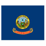 Idaho Flag: the Gem State, America Mountain West Cutout<br><div class="desc">The Idaho state flag, a simple yet powerful emblem, was officially adopted in 1907. Its design, a field of blue emblazoned with the state seal, reflects the state's natural beauty and rich history. The blue field symbolizes the vast skies and abundant water resources that characterize Idaho. - At the heart...</div>