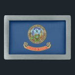 Idaho State Flag Belt Buckle<br><div class="desc">The flag of the state of Idaho consists of the state seal on a field of blue. The words “State of Idaho” appear in gold letters on a red and gold band below the seal. According to the official description of the flag, there should also be a fringe of gold...</div>