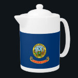 Idaho State Flag Teapot<br><div class="desc">The flag of the state of Idaho consists of the state seal on a field of blue. The words “State of Idaho” appear in gold letters on a red and gold band below the seal. According to the official description of the flag, there should also be a fringe of gold...</div>