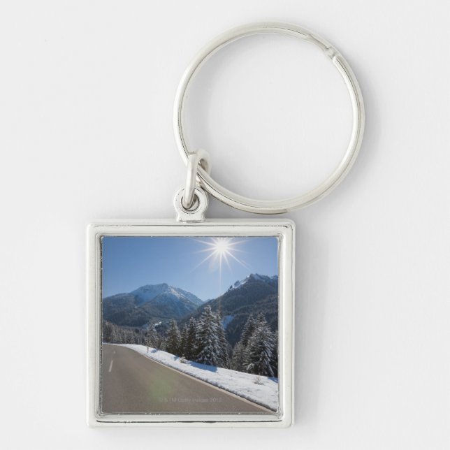 Idyllic empty road thrugh a winter landscape, 2 keychain (Front)
