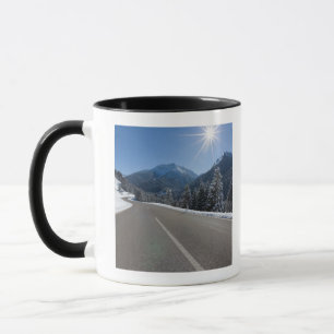 Idyllic empty road thrugh a winter landscape, mug