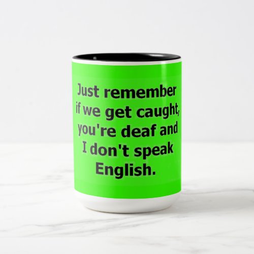 IF WE GET CAUGHT YOU ARE DEAF AND I DONT SPEAK EN Two_Tone COFFEE MUG