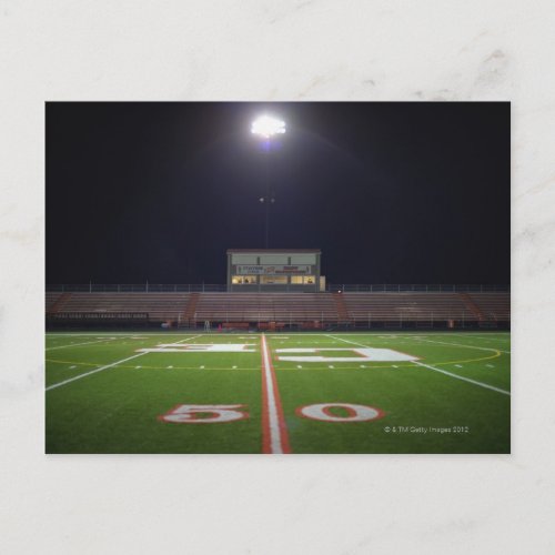 Illuminated American football field at night Postcard
