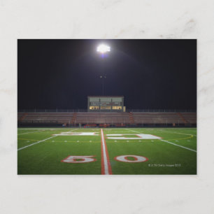 Illuminated American football field at night Postcard