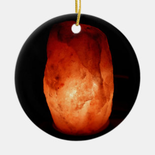 Illuminated Orange Himalayan Salt Lamp Light on a Ceramic Ornament