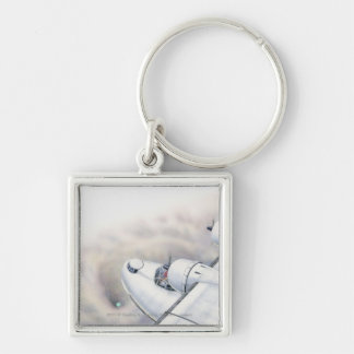 Illustration of a plane flying above wormhole keychain