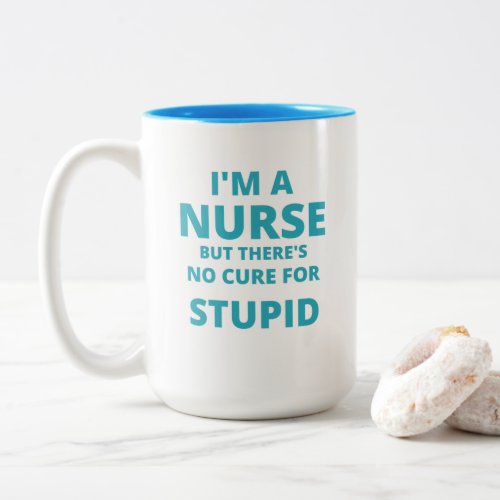 Im a NURSE but there no cure for STUPID Funny Two_Tone Coffee Mug