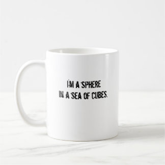 I'm a spherein a sea of cubes. coffee mug